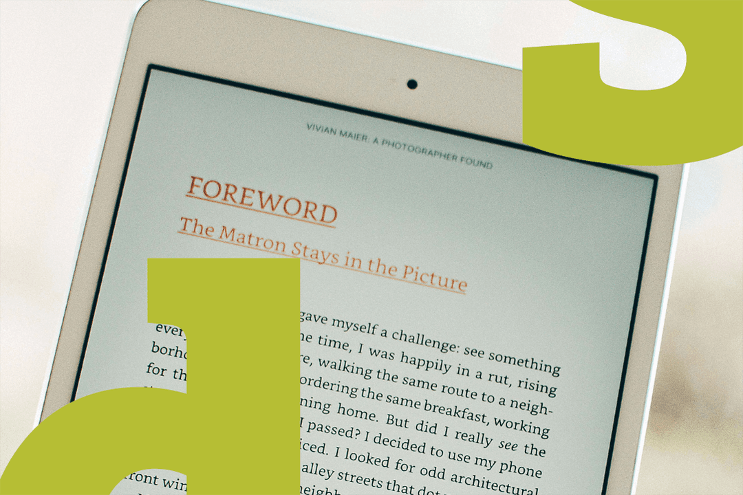  Close-up of a tablet displaying an open e-book with the title 'Foreword' visible on the screen.